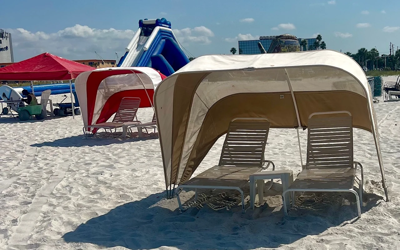 Our tan beach cabana with two loungers